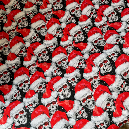 Pattern of Santa Claus faces with red hats and black backgrounds