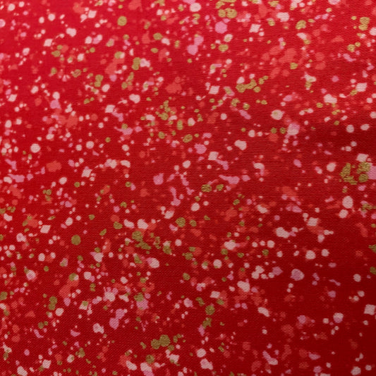 Dot pattern fabric swatch on a red background