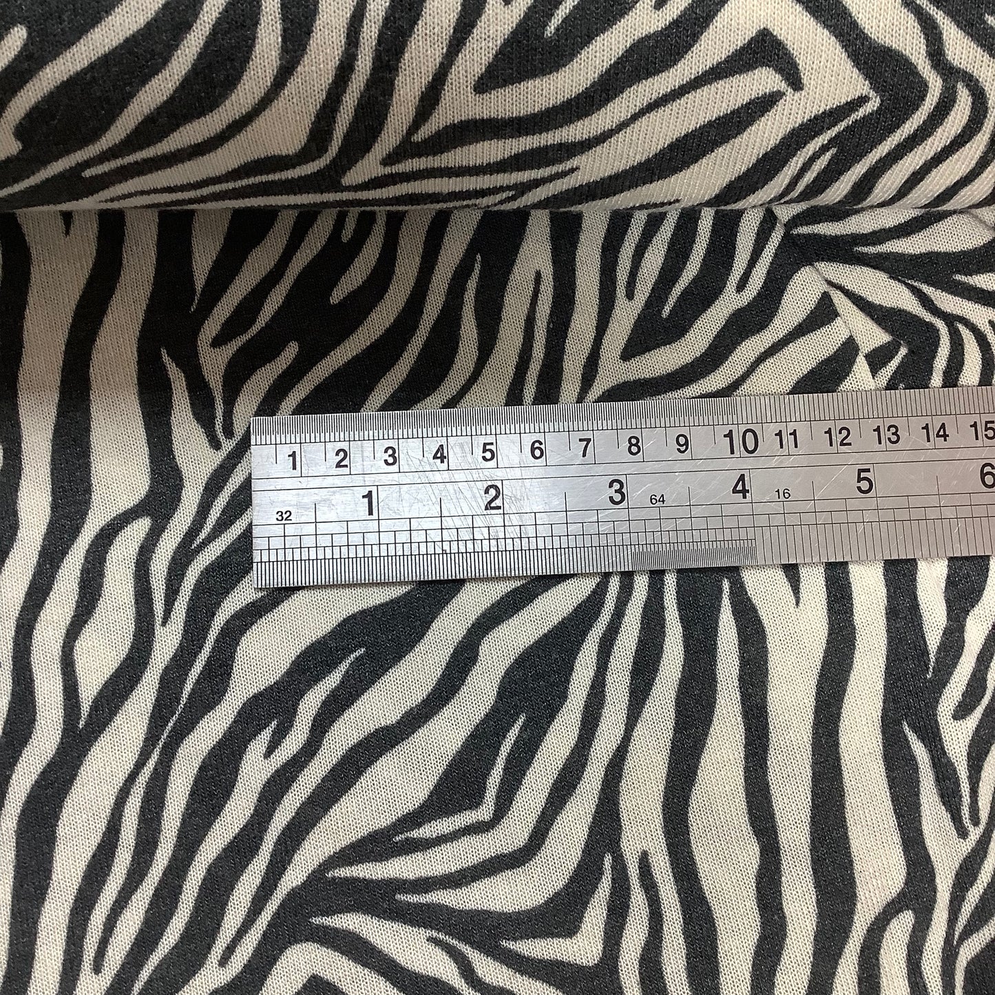 Lightweight Black and Ivory Animal Print Stretch Jersey Fabric 95% Viscose 5% Elastane Dressmaking
