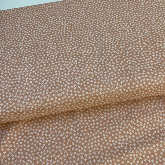 Brown fabric with a small white star pattern