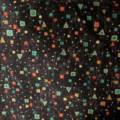 Patterned fabric with geometric shapes on a black background